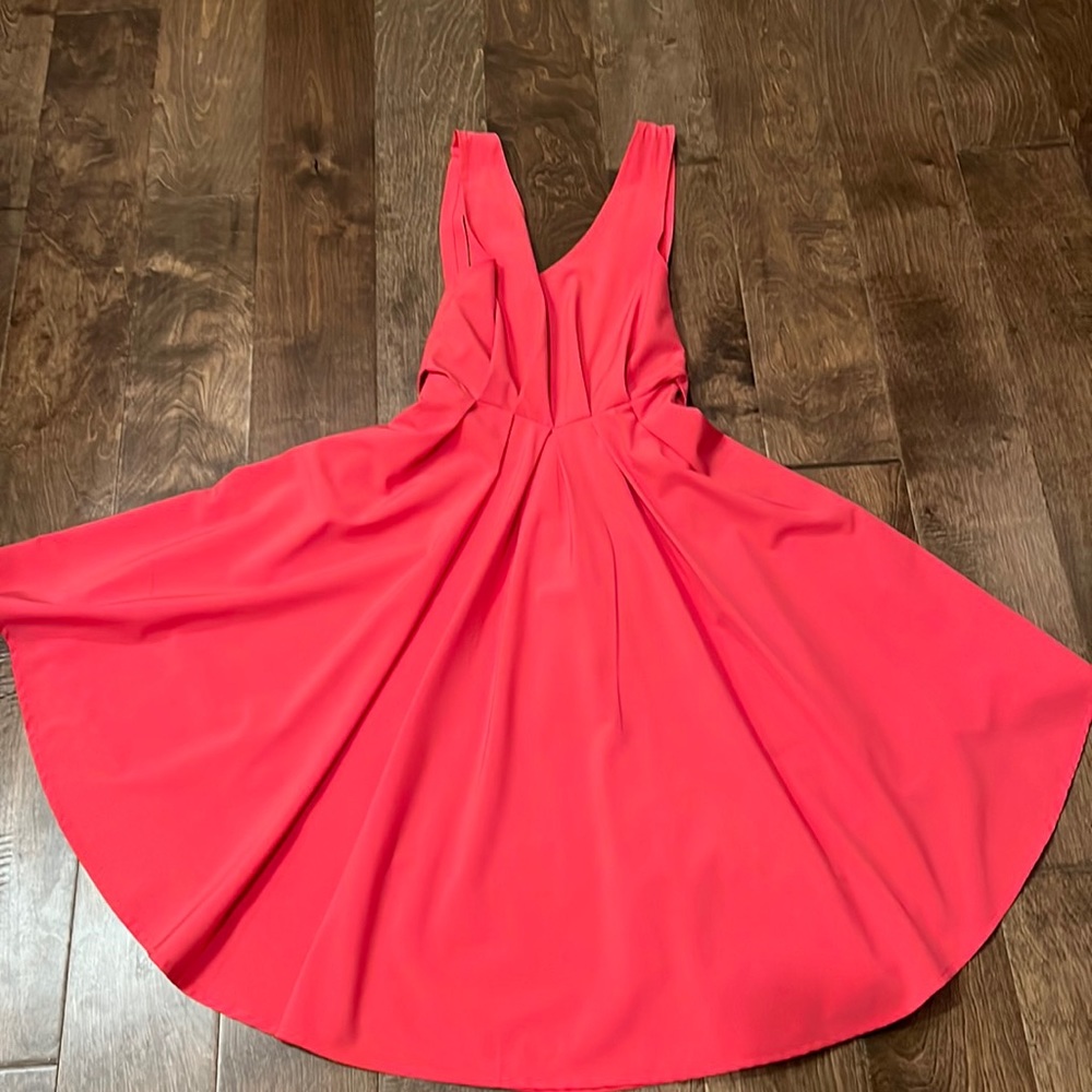 Pink cocktail dress, low back,XS, pink in color. Has tie in back at zipper.